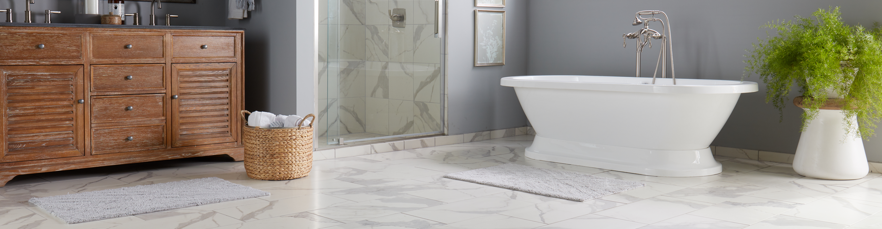 white marble tile in bath with standalone tub 